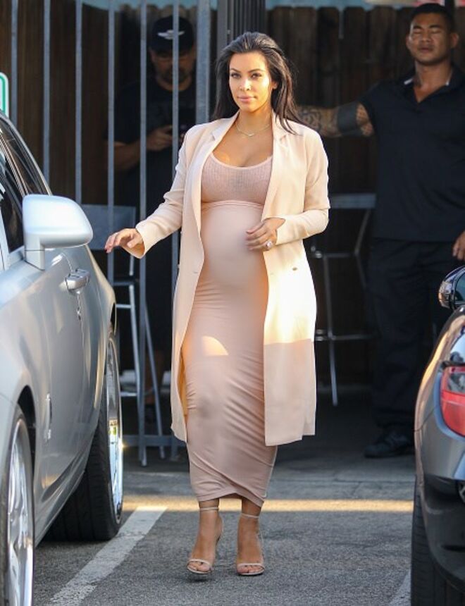 Casaco Maison Margiela, Saia Wolford, Top Faith Connexion e sapatos Tom Ford