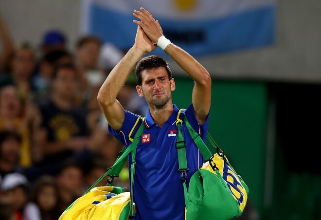 O tenista Novak Djokovic depois de perder com Juan Martin Del Potro uma partida de ténis | Ténis