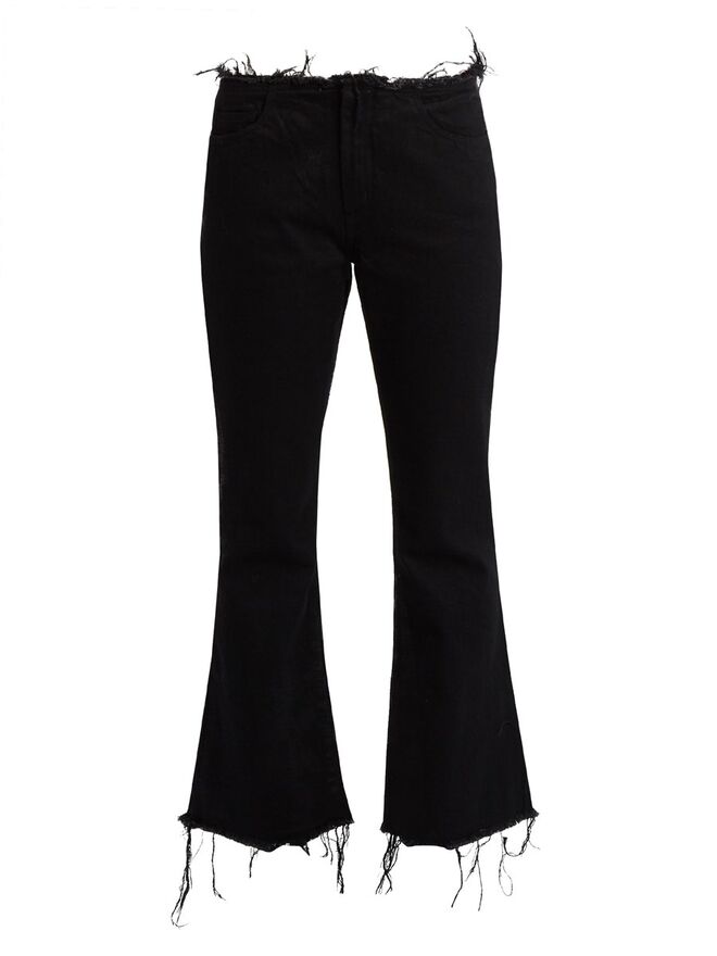 Frayed-edge flated jeans Marques' Almeida, €255, em matchesfashion.com