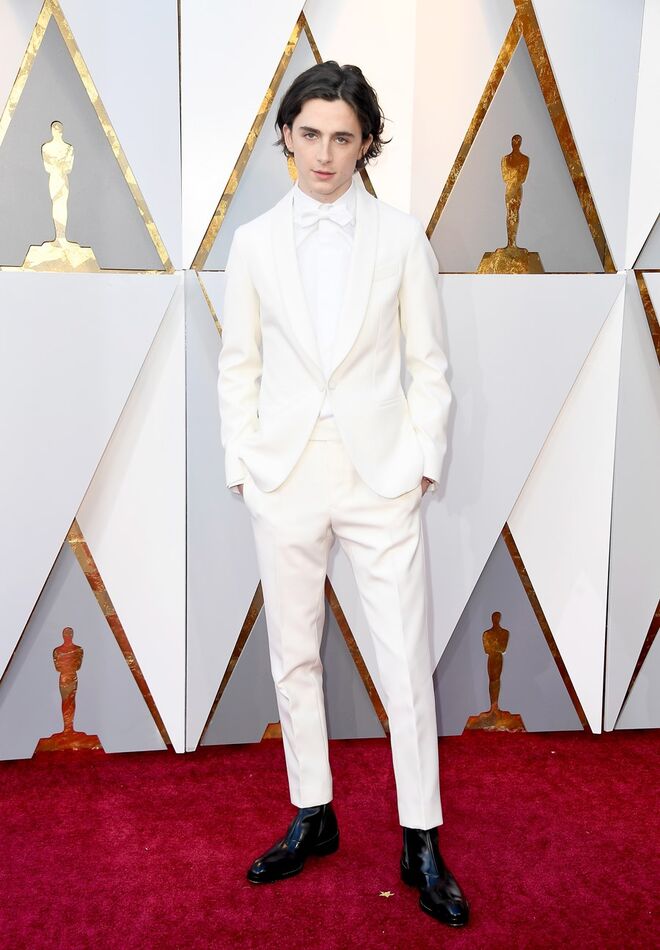 Timothee Chalamet em Berluti, nomeado pela primeira vez Melhor Ator para os Óscares, os Globos de Ouro e os BAFTA.
