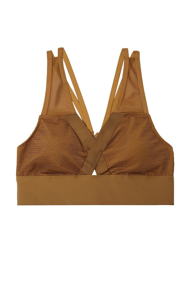 Soutien desportivo ocre, €25.99, Oysho 
