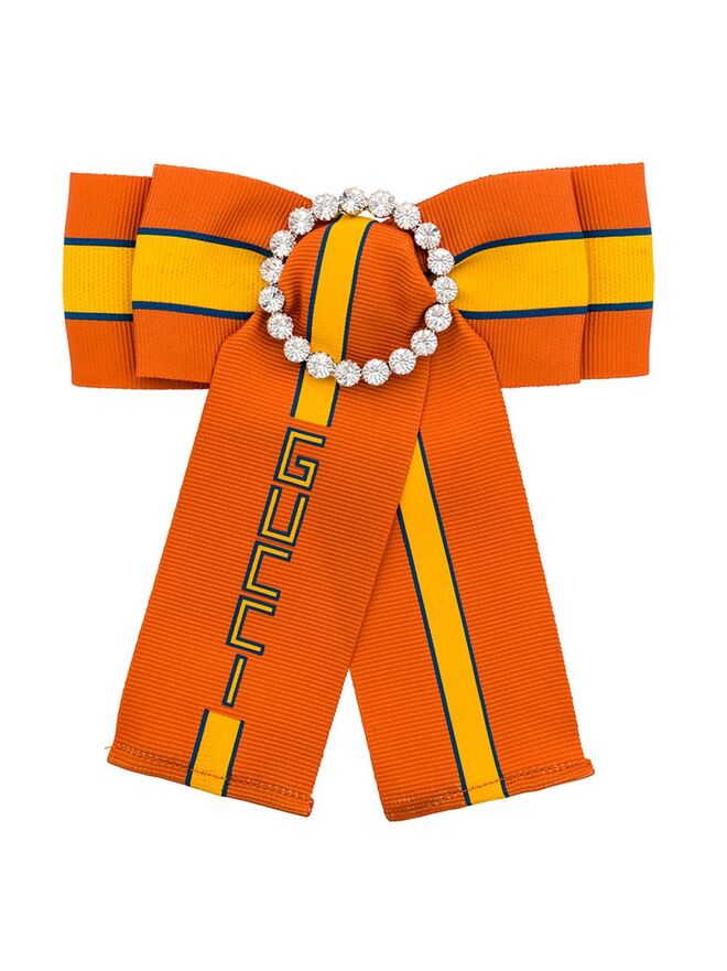 Laço alfinete de dama, €451, Gucci, farfetch.com