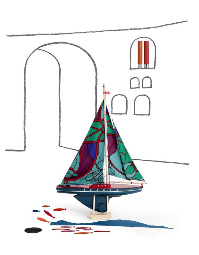 Peça do atelier Petit h, barco com os famosos lenços de seda Hermès como velas.