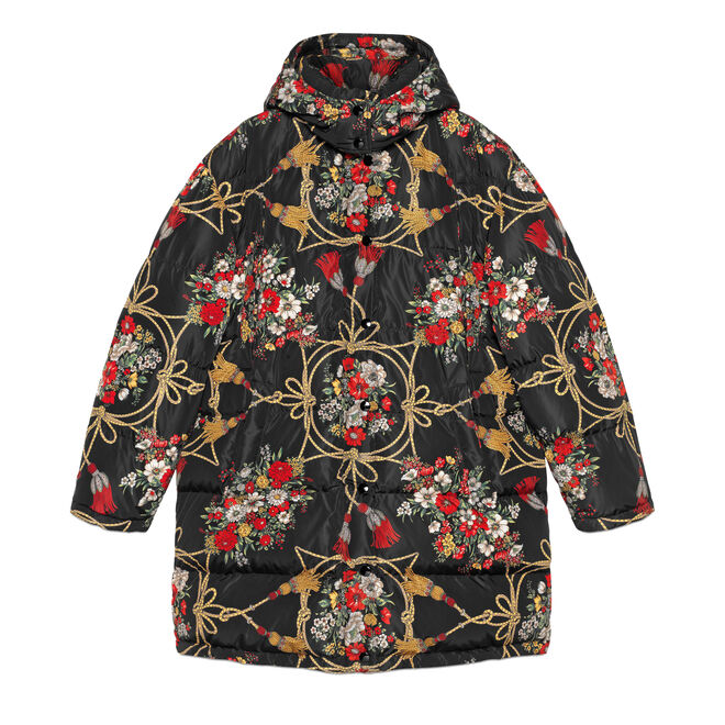 Padded cape coat with flowers and tassels, €2.980, Gucci