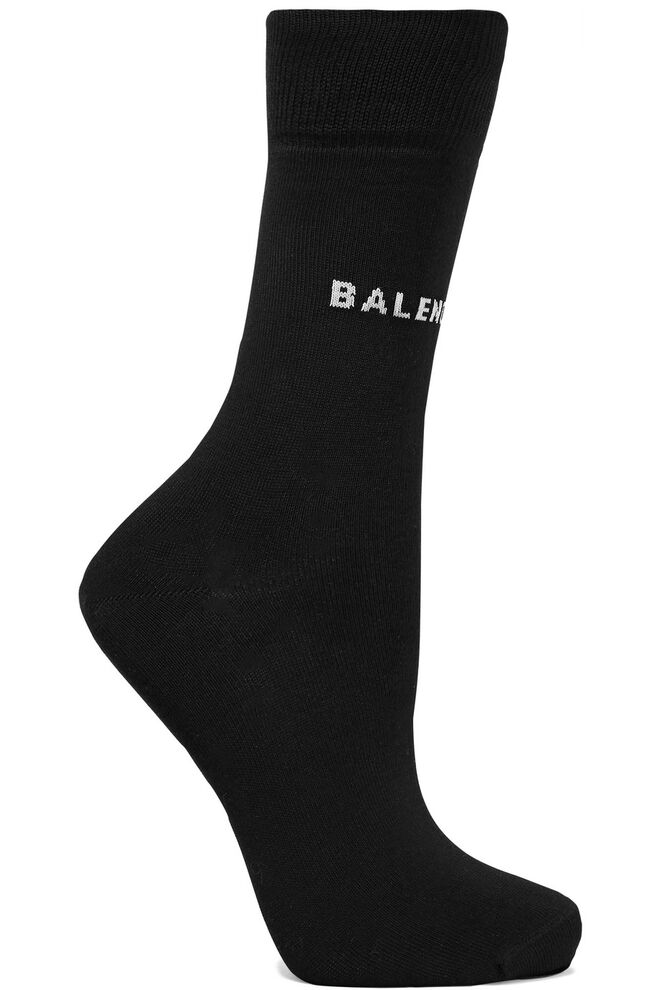 Meias, €75, Balenciaga, em www.net-a-porter.com