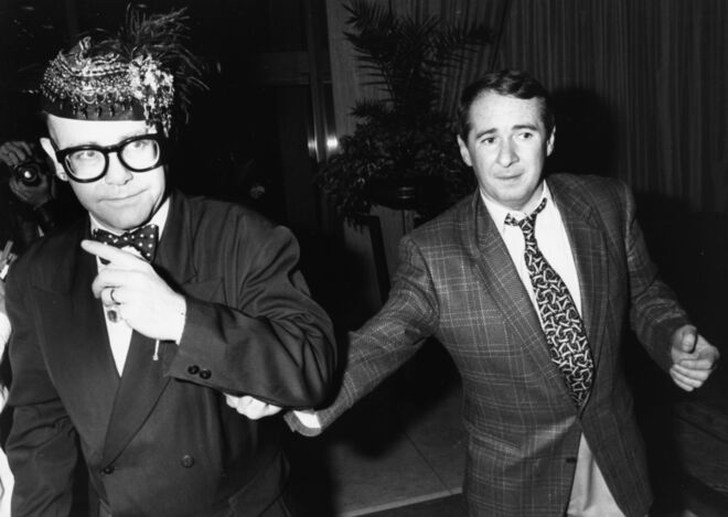 Elton John e John Reid em 1988. 