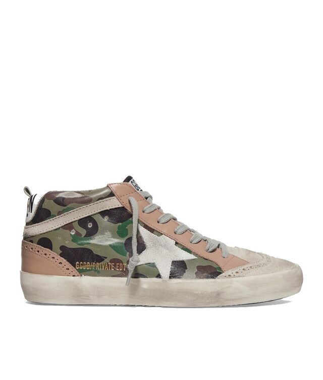 Sapatilhas Mid Star, €430, Golden Goose, em www.net-a-porter.com