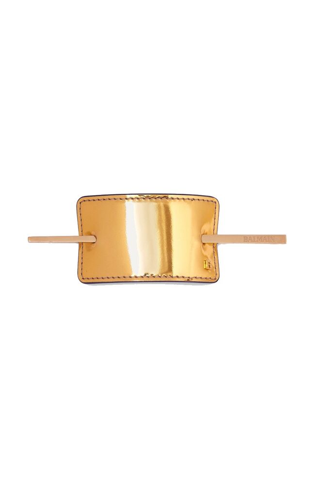 Pin, €225, Balmain, em www.net-a-porter.com