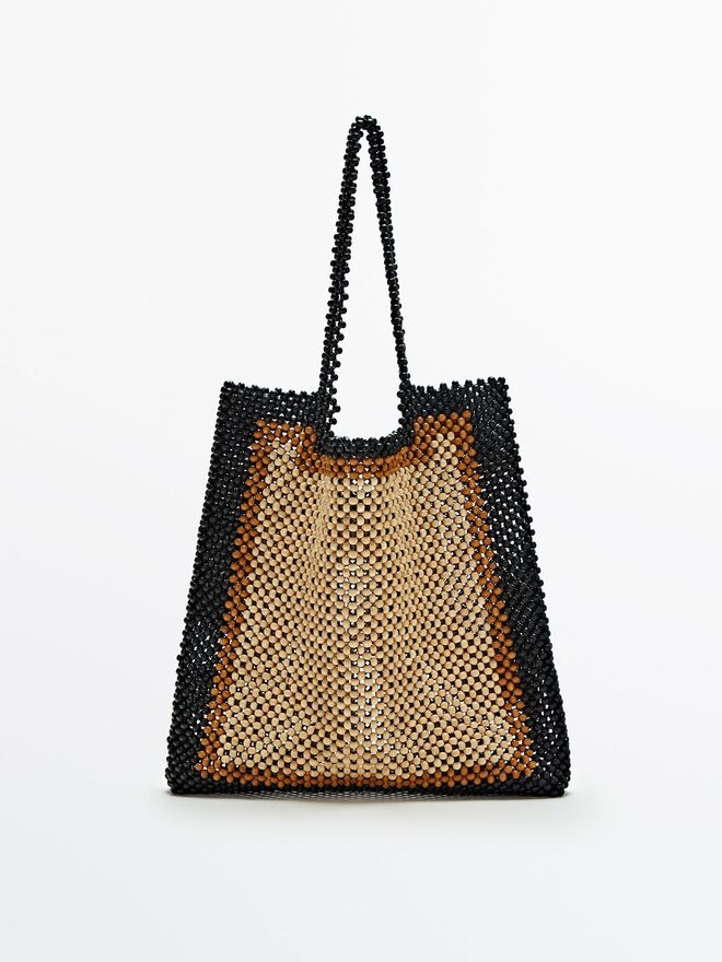 Carteira La Totte em madeira, €140, Massimo Dutti.