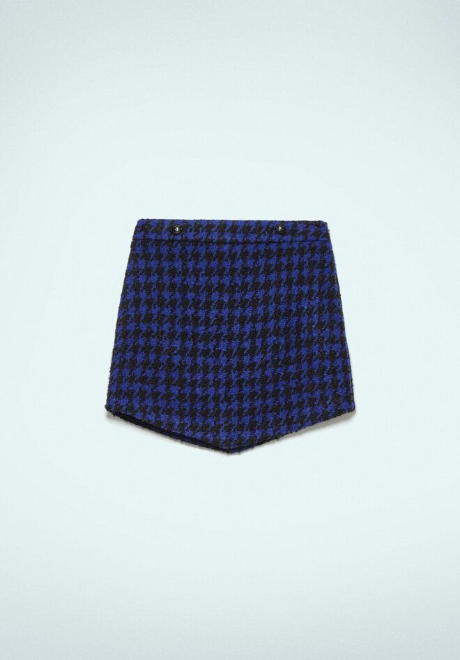 Saia em lã, €57, Gaëlle Paris.