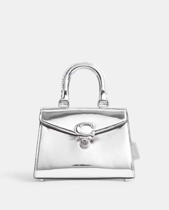 Carteira Sammy em pele, €550, Coach, em Elcorteingles.pt