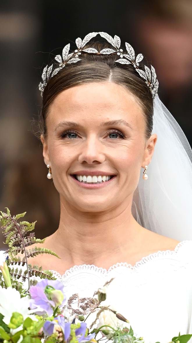 Completing the look, the bride wore the historic Fabergé Myrtle Leaf Tiara, a jewel from 1906 that was originally made to be worn by brides of the Grosvenor family on their wedding day.