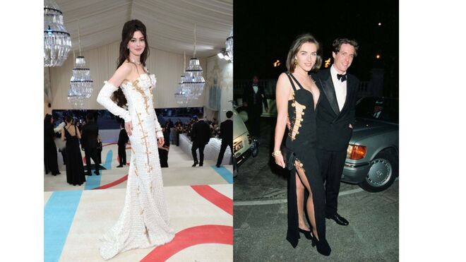 Anne Hathaway na Met Gala de 2023, com um vestido inspirado no mesmo da Versace que Elizabeth Hurley usou para a estreia de "Quatro Casamentos e um Funeral", em 1994.