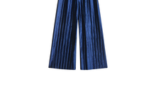 Calças de veludo azul da KIABI: glamour e conforto para celebrar o Natal com elegância